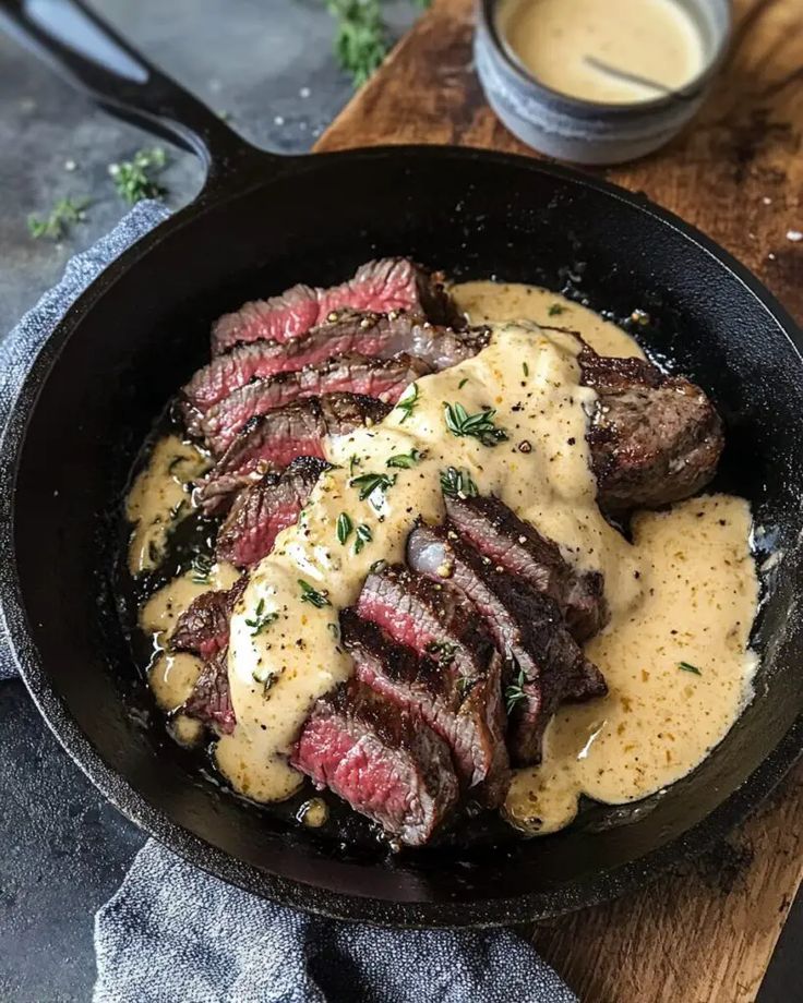 cast iron bavette steak with whiskey garlic cream sauce 